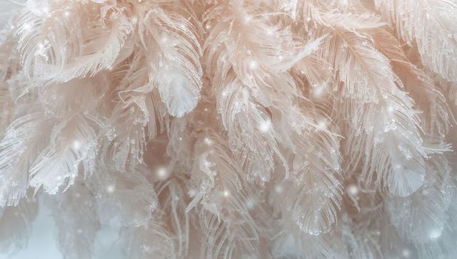 Delicate feathery frost filaments macro closeup showing ethereal ice-crystal plumes