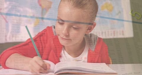 Young Girl Focused on Homework in Classroom with World Map