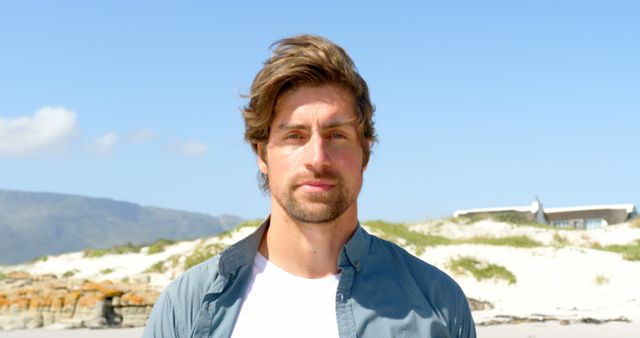 Confident Young Man Standing on Sunny Beach - Download Free Stock Images Pikwizard.com