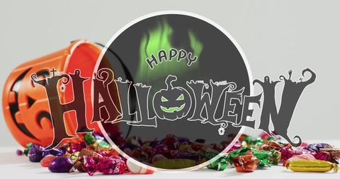 Halloween Candy Spill with Spooky Greeting Overlay - Download Free Stock Images Pikwizard.com