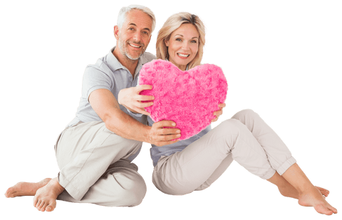 smiling senior couple holding pink heart cushion transparent background - Download Free Stock Videos Pikwizard.com