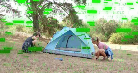 Two Friends Pitching Blue Tent Outdoors with Green Binary Glitch Overlay, Camping Teamwork