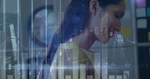 Businesswoman analyzing statistical data with graphs overlay