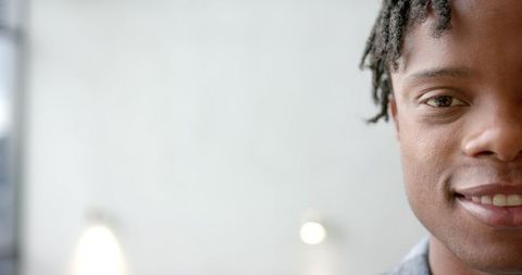 Smiling Young Man Enjoying Serenity Indoors
