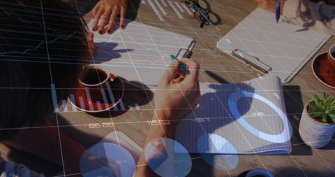 Team Analyzing Data Overlays at Office Meeting