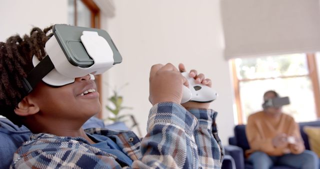 Excited Boy Using Virtual Reality Headset and Controller at Home - Download Free Stock Images Pikwizard.com
