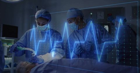 Surgical Team Performing Airway Management in Operating Room with ECG Overlay Visualization