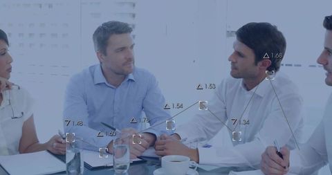 Diverse Team Analyzing Digital Data Connections in Meeting