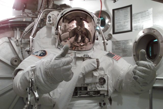 JSC2001-E-11702 (9 April 2001) ---  Astronaut James F. Reilly, STS-104 mission specialist, participates in an Extravehicular Mobility Unit (EMU) fit check in one of the chambers in the Crew Systems Laboratory at the Johnson Space Center (JSC).  The STS-104 mission to the International Space Station (ISS) represents the Space Shuttle Atlantis' first flight using a new engine and is targeted for a liftoff no earlier than June 14, 2001.