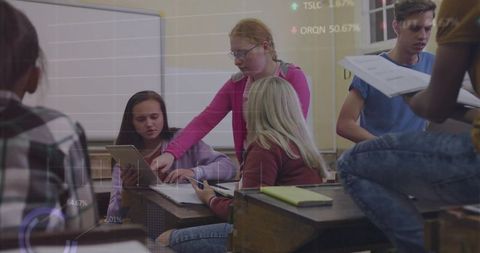 Teenage Students Collaborating with Tablet in Classroom Setting
