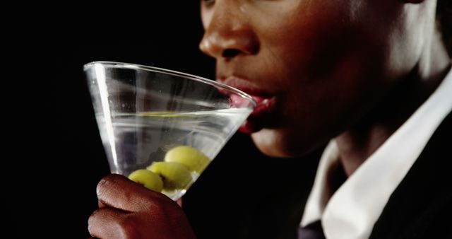 Elegant Woman Sipping Martini with Olives - Download Free Stock Images Pikwizard.com