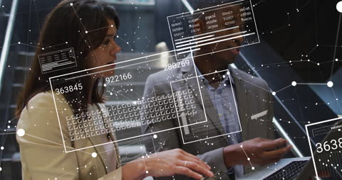 Business Professionals Surrounded by Digital Data Displays