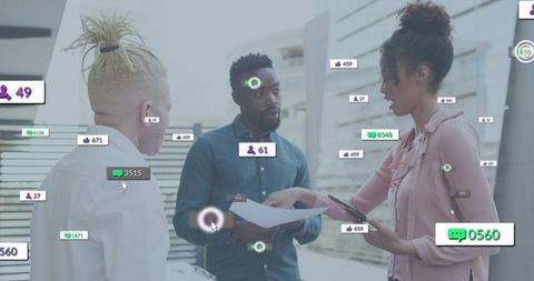 Team reviewing social media analytics with digital engagement overlays in modern office