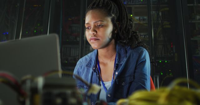 Female IT Technician Working on Laptop in Server Room - Download Free Stock Images Pikwizard.com