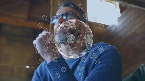 Businessman Analyzing Global Giant Network on Laptop