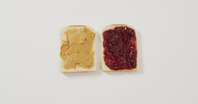 Close up view of peanut butter and jelly sandwich with copy space on white surface - Download Free Stock Photos Pikwizard.com