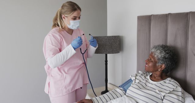 Nurse examining elderly female patient in hospital room - Download Free Stock Images Pikwizard.com