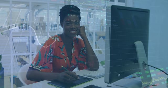 Smiling Businesswoman Analyzing Data at Modern Workplace - Download Free Stock Images Pikwizard.com