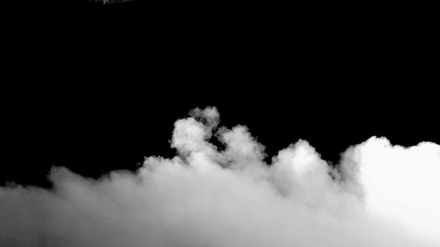 Abstract depiction of white smoke swirling against a deep black background, creating a striking contrast. Ideal for use in artistic projects, presentations on atmospheric conditions, or dramatic video production intros. The motion of the smoke can evoke themes of mystery or intrigue.