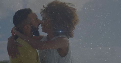 Romantic Couple Embracing Outdoors with Magical Effect