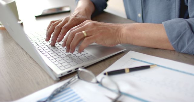 Close-up of Businessman Typing on Laptop at Desk - Download Free Stock Images Pikwizard.com