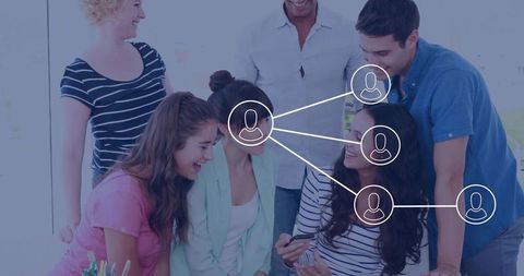 Coworkers examining virtual network display during meeting