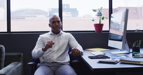 Businessman in Contemporary Office Using Computer