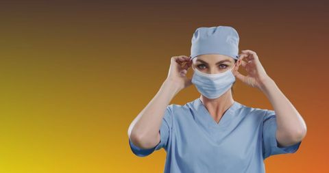 Healthcare Professional Adjusting Mask with Determined Expression