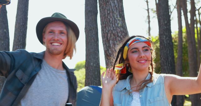 Couple raising their coffee cups at festival 