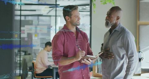 Professional Male Colleagues Collaborating in Modern Office Environment