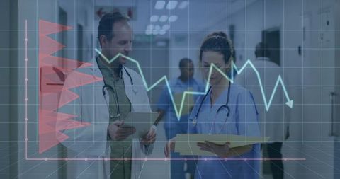 Medical Professionals Analyzing Data in Hospital Hallway