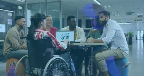 Diverse team collaborating in inclusive modern office environment