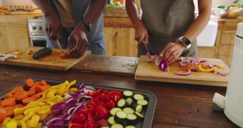 Couple Preparing Colorful Vegetables Together in Kitchen