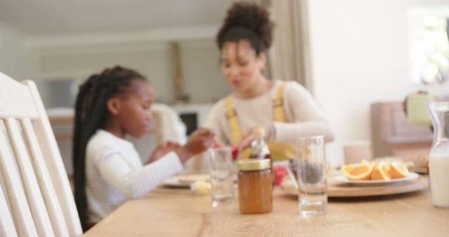 Mother and Daughter Having Breakfast Together in Cozy Kitchen - Download Free Stock Images Pikwizard.com