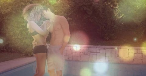 Romantic Couple Embracing by Backyard Pool in Warm Light