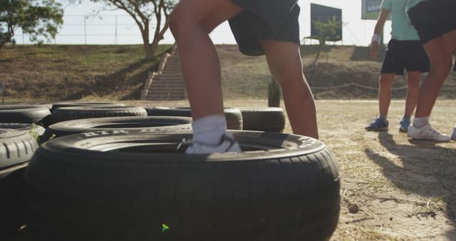 People Exercising Outdoors with Tires in Sunny Park - Download Free Stock Images Pikwizard.com