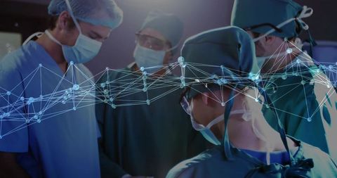 Team of Surgeons Using Futuristic Technology in Operating Room