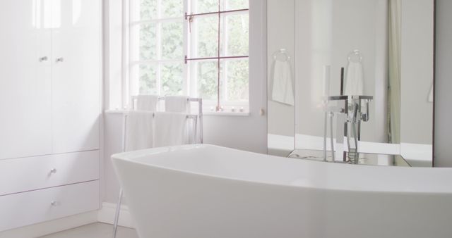 Image of bathtub in modern white fresh bathroom. Health and beauty, leisure time, domestic life and lifestyle concept.