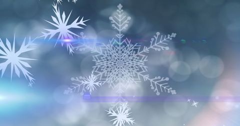 Glowing snowflakes on festive winter background