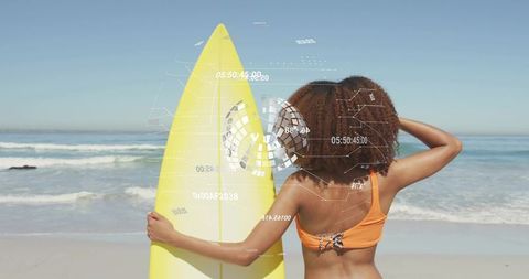 Woman holding yellow surfboard on sunny beach with futuristic ar hud overlay