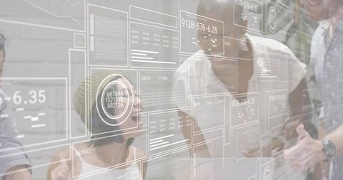 Modern team collaborating around transparent hud dashboards and data visualization overlays