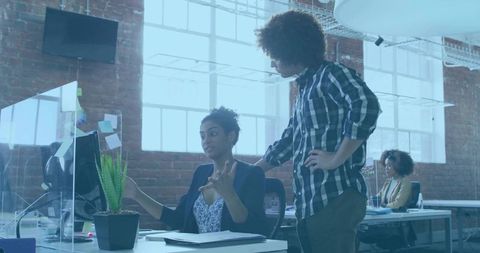 Collaboration in Creative Office Environment with Diverse Team