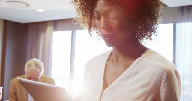 Professional Businesswoman Using Tablet in Modern Office - Download Free Stock Images Pikwizard.com