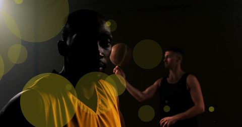 Basketball players with dynamic light effects in studio