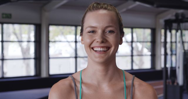 Smiling Young Woman in Gym Setting - Download Free Stock Images Pikwizard.com