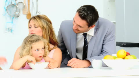 Businessman Enjoying Breakfast with Family in Modern Kitchen