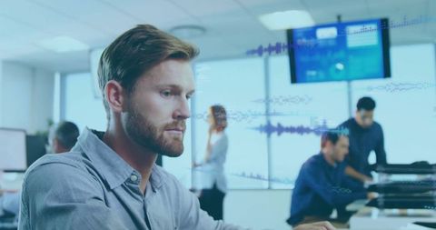 Focused Professional Analyzing Data in Modern Office Environment