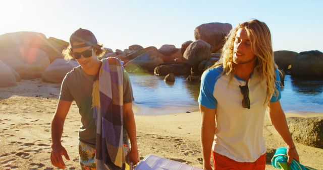 Friends on Sunny Beach with Cooler, Towels, Sunglasses at Sunset - Download Free Stock Images Pikwizard.com