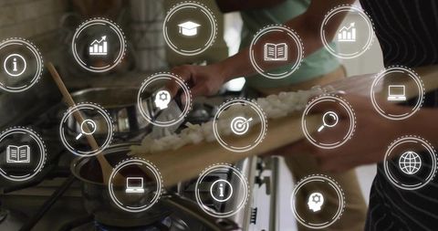 Chopping onions over gas stove and adding to pan with augmented reality kitchen interface