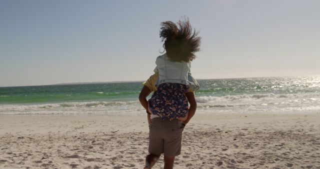 Father Carrying Daughter on Beach - Download Free Stock Images Pikwizard.com